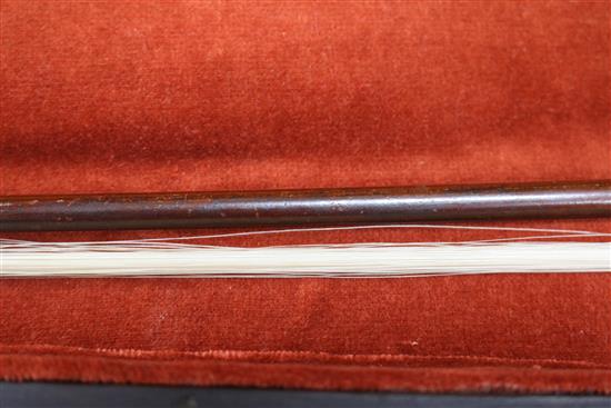 A silver mounted violin bow, an ivory mounted violin bow and a late 19th century German violin, cased